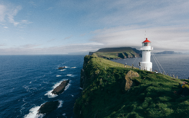 lighthouse near body of water